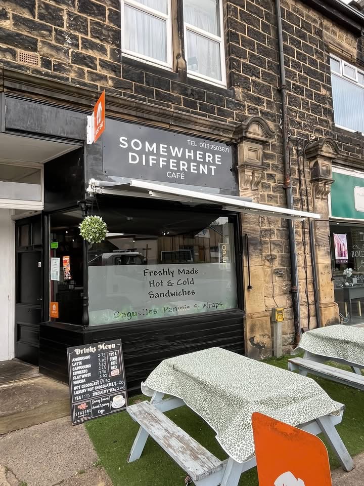 Somewhere Different shopfront on Kirk Lane with outdoor tables